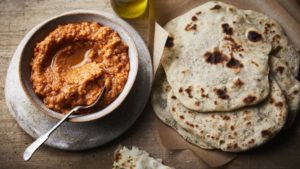Carrot hummus with garlic and herb flatbreads