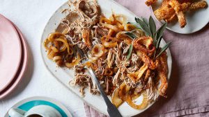 Slow-roast hand and spring with crackling and onion gravy