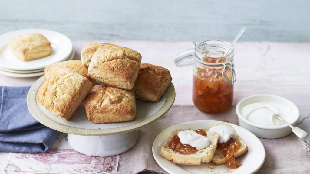 Sweet scones with coconut cream and pink peppercorn pineapple jam