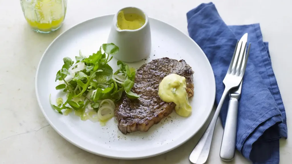 Steak with béarnaise sauce and watercress, rocket and shallot salad
