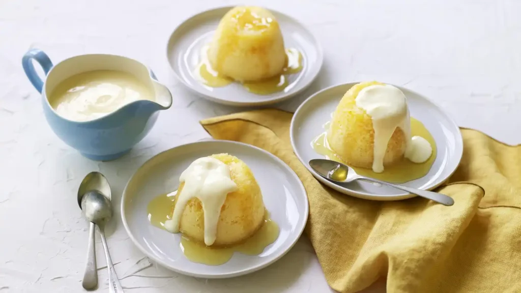 Steamed lemon sponge puddings with custard