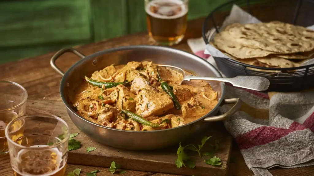 Chicken tikka masala with chapatis and pilau rice
