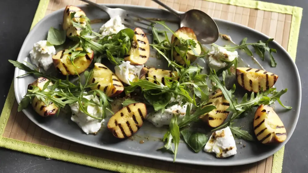 Grilled peach, burrata and basil salad with Dijon dressing